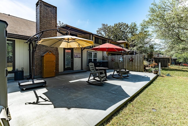 view of patio / terrace featuring fence