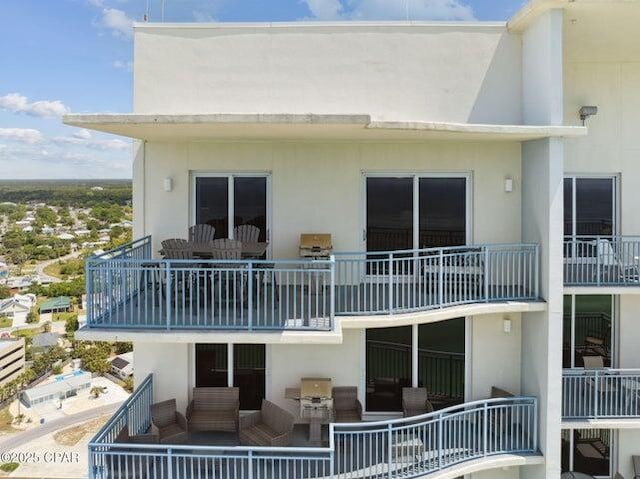 16701 Front Beach Rd Unit 2307, Panama City Beach, FL 32413 - back of house featuring stucco siding and a balcony
