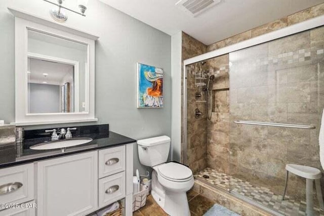 16701 Front Beach Rd Unit 2307, Panama City Beach, FL 32413 - bathroom featuring toilet, visible vents, a shower stall, and vanity