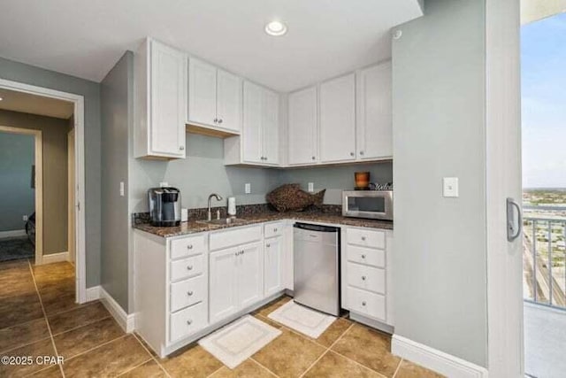 16701 Front Beach Rd Unit 2307, Panama City Beach, FL 32413 - kitchen featuring a sink, appliances with stainless steel finishes, and white cabinetry