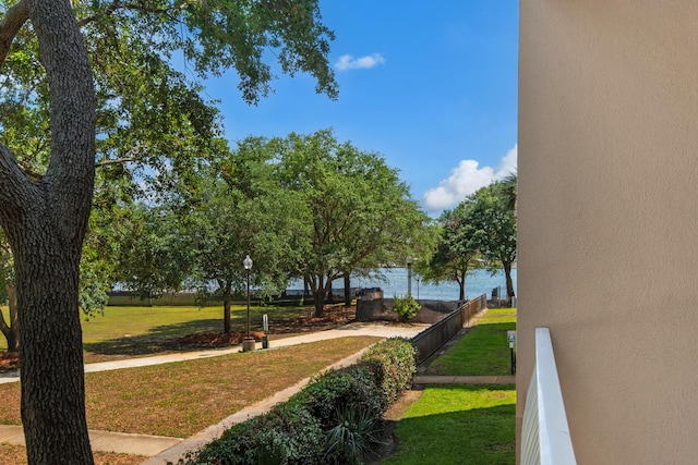 113 SE Brooks St Unit 201, Fort Walton Beach, FL 32548 - view of community featuring a lawn and fence