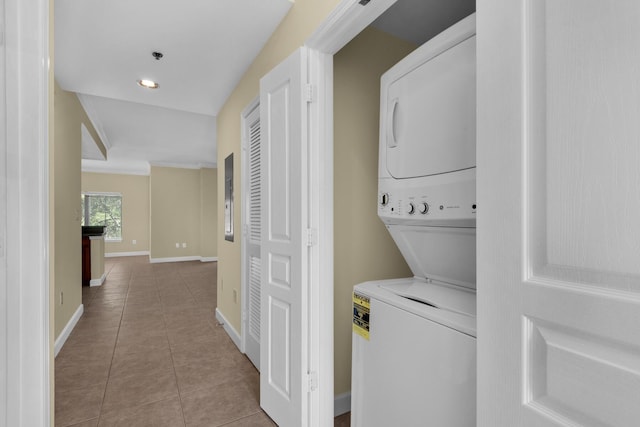 113 SE Brooks St Unit 201, Fort Walton Beach, FL 32548 - clothes washing area featuring tile patterned floors, baseboards, laundry area, and stacked washer / dryer