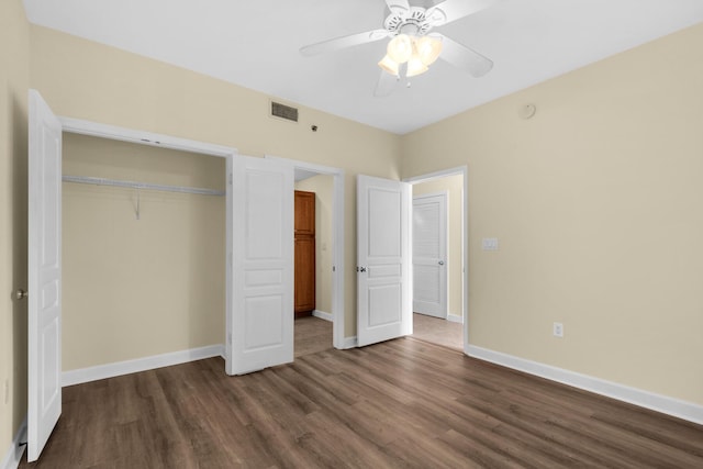 113 SE Brooks St Unit 201, Fort Walton Beach, FL 32548 - unfurnished bedroom with baseboards, a closet, dark wood-style floors, and visible vents