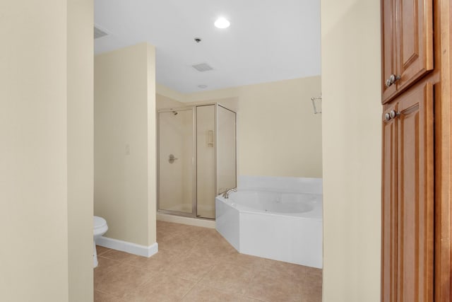 113 SE Brooks St Unit 201, Fort Walton Beach, FL 32548 - full bathroom featuring tile patterned flooring, toilet, baseboards, a bath, and a stall shower