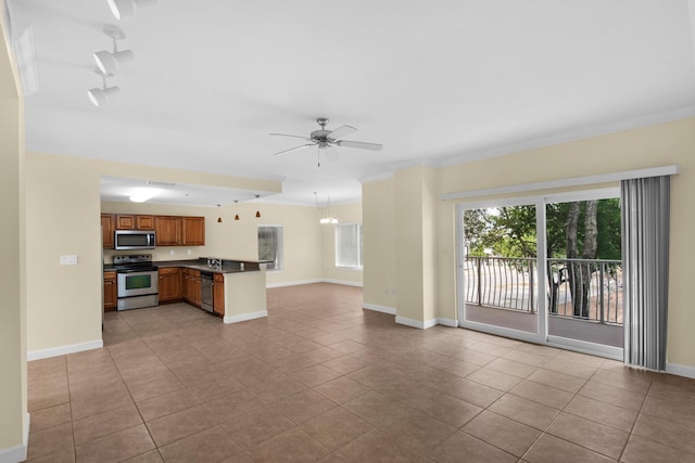 113 SE Brooks St Unit 201, Fort Walton Beach, FL 32548 - unfurnished living room with baseboards, light tile patterned floors, a ceiling fan, and a healthy amount of sunlight