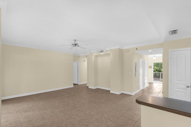 113 SE Brooks St Unit 201, Fort Walton Beach, FL 32548 - unfurnished living room with crown molding, ceiling fan, visible vents, and light tile patterned floors