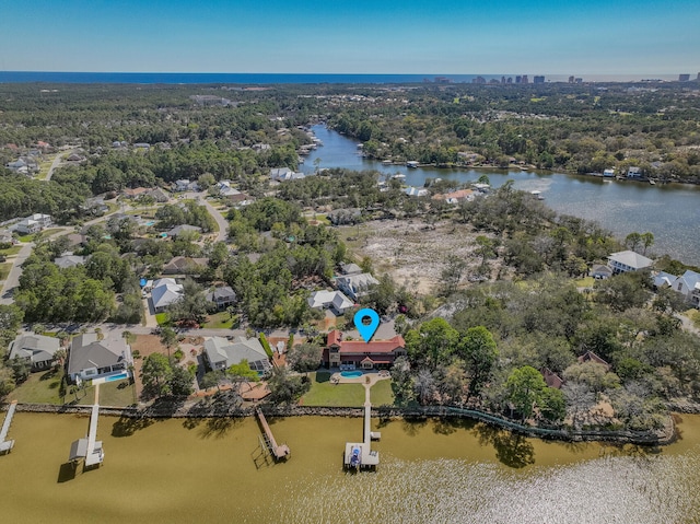 bird's eye view with a water view and a residential view