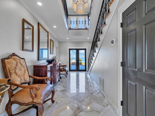 foyer with an inviting chandelier, stairway, marble finish floor, visible vents, and french doors