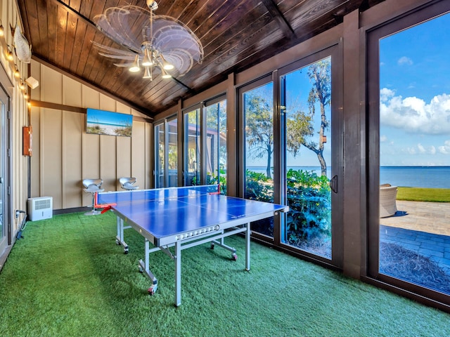 playroom with carpet, a water view, vaulted ceiling, and wooden ceiling