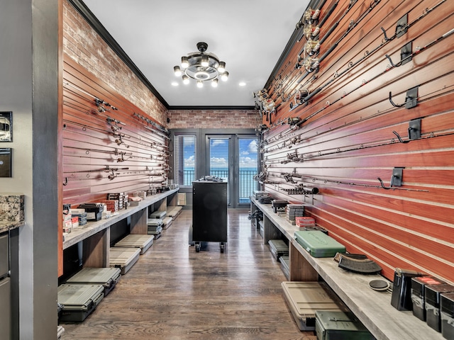 mudroom featuring ornamental molding and wood finished floors