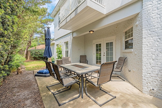 597 Avalon Blvd, Miramar Beach, FL 32550 - view of patio / terrace featuring fence, french doors, and outdoor dining area