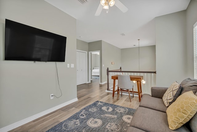 597 Avalon Blvd, Miramar Beach, FL 32550 - living area with a ceiling fan, baseboards, visible vents, and wood finished floors