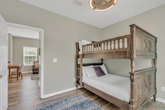 597 Avalon Blvd, Miramar Beach, FL 32550 - bedroom featuring baseboards, visible vents, and wood finished floors