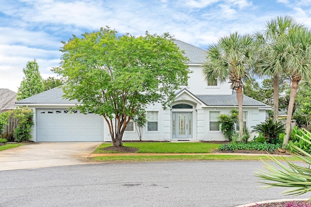 597 Avalon Blvd, Miramar Beach, FL 32550 - view of front of house with fence, driveway, a shingled roof, and a garage