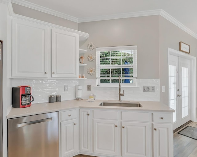 597 Avalon Blvd, Miramar Beach, FL 32550 - kitchen featuring white cabinetry, tasteful backsplash, a sink, and dishwasher