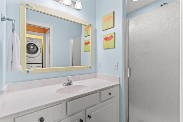 8054 Gulf Blvd, Navarre, FL 32566 - bathroom with a stall shower, stacked washer / drying machine, and vanity