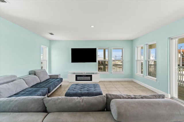8054 Gulf Blvd, Navarre, FL 32566 - living area with baseboards, visible vents, and light tile patterned floors