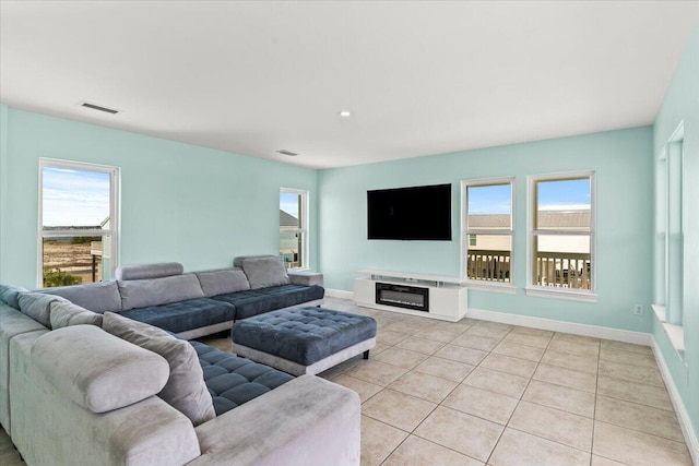 8054 Gulf Blvd, Navarre, FL 32566 - living area with baseboards, visible vents, plenty of natural light, and light tile patterned floors