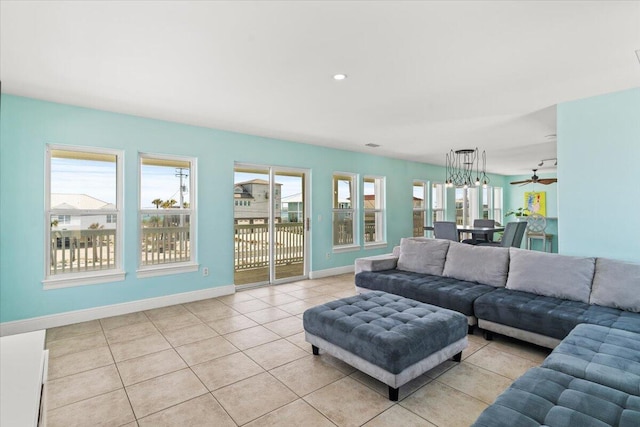 8054 Gulf Blvd, Navarre, FL 32566 - living room featuring light tile patterned flooring, baseboards, and a ceiling fan