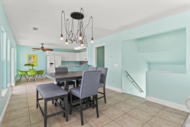8054 Gulf Blvd, Navarre, FL 32566 - dining room with light tile patterned floors, baseboards, ceiling fan, and visible vents