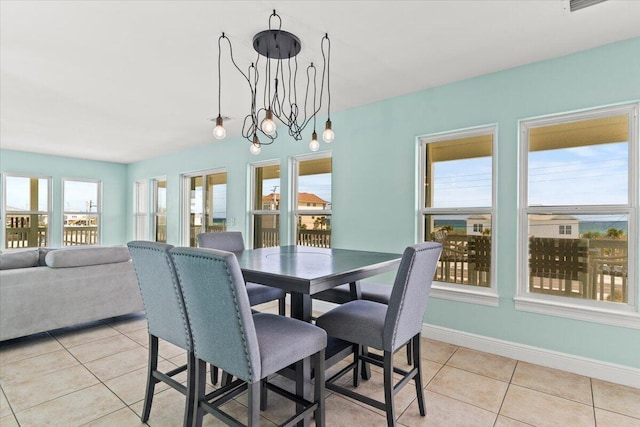 8054 Gulf Blvd, Navarre, FL 32566 - dining area with light tile patterned floors and baseboards