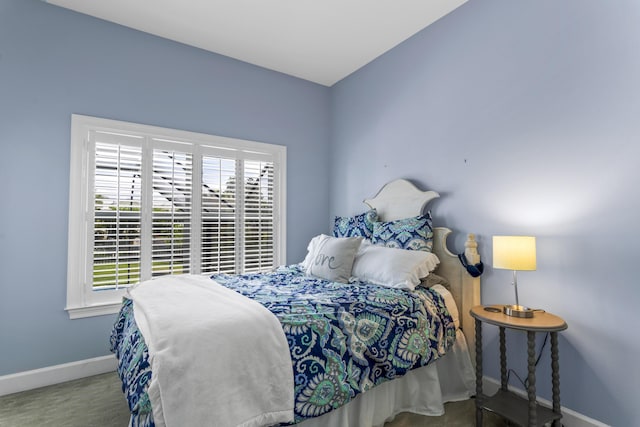 bedroom featuring baseboards