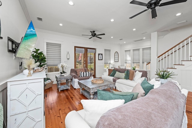 50 Cinnamon Fern Ln, Santa Rosa Beach, FL 32459 - living room featuring wood finished floors, ornamental molding, visible vents, stairway, and ceiling fan