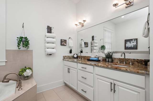 50 Cinnamon Fern Ln, Santa Rosa Beach, FL 32459 - bathroom with baseboards, tile patterned flooring, double vanity, and a sink