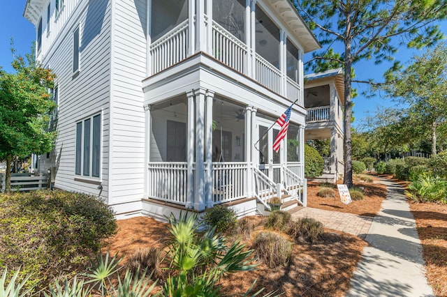 50 Cinnamon Fern Ln, Santa Rosa Beach, FL 32459 - view of side of home featuring a balcony, a porch, and ceiling fan