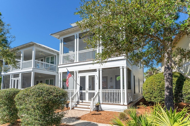 50 Cinnamon Fern Ln, Santa Rosa Beach, FL 32459 - view of front facade with a sunroom, a ceiling fan, and a balcony