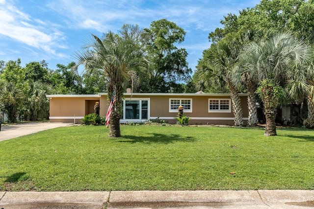 361 NE Gardner Dr, Fort Walton Beach, FL 32548 - ranch-style house featuring concrete driveway, a front lawn, and a carport