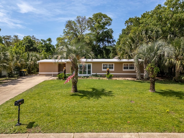 361 NE Gardner Dr, Fort Walton Beach, FL 32548 - view of front of home featuring driveway and a front yard