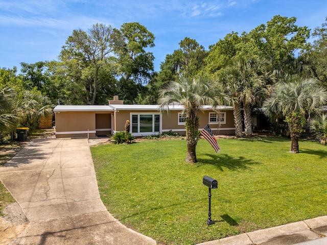 361 NE Gardner Dr, Fort Walton Beach, FL 32548 - view of front of home featuring driveway and a front yard