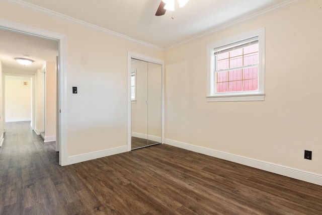 361 NE Gardner Dr, Fort Walton Beach, FL 32548 - unfurnished bedroom featuring dark wood-type flooring, baseboards, a closet, ornamental molding, and a ceiling fan