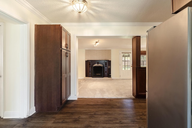 361 NE Gardner Dr, Fort Walton Beach, FL 32548 - hall with a textured ceiling, ornamental molding, dark wood finished floors, and baseboards
