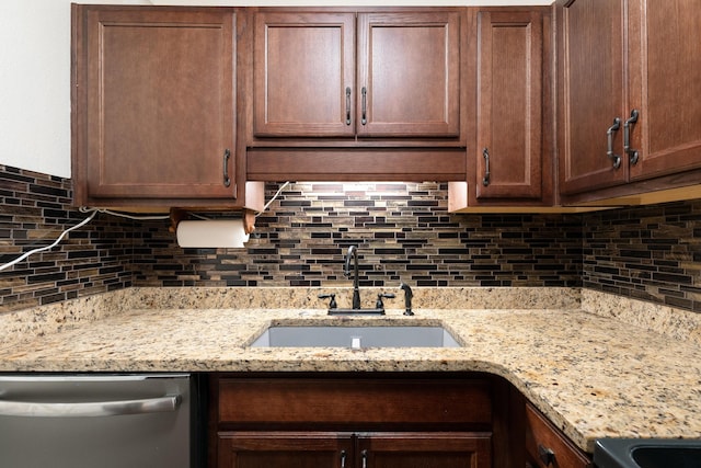 361 NE Gardner Dr, Fort Walton Beach, FL 32548 - kitchen with dishwasher, a sink, decorative backsplash, and light stone countertops