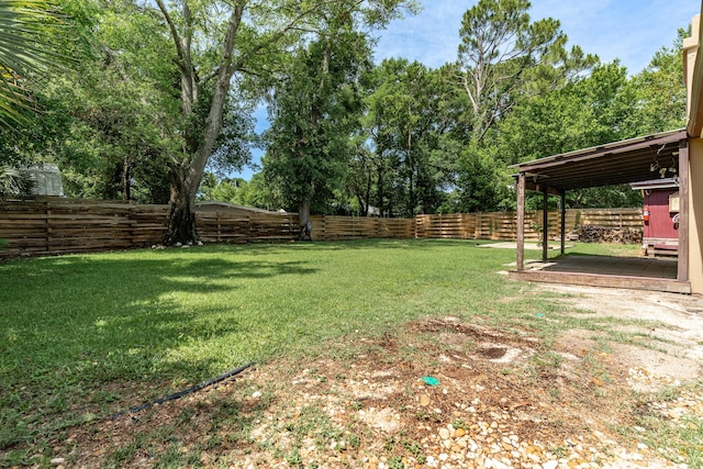 361 NE Gardner Dr, Fort Walton Beach, FL 32548 - view of yard featuring a deck and view of scattered trees