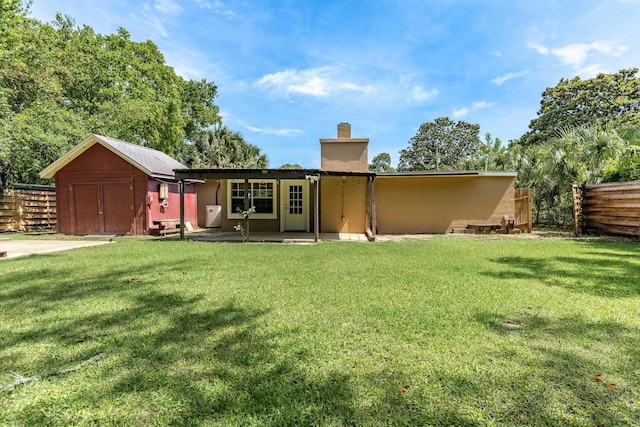 361 NE Gardner Dr, Fort Walton Beach, FL 32548 - rear view of house with a chimney and a patio area