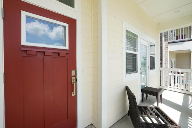 doorway to property with covered porch