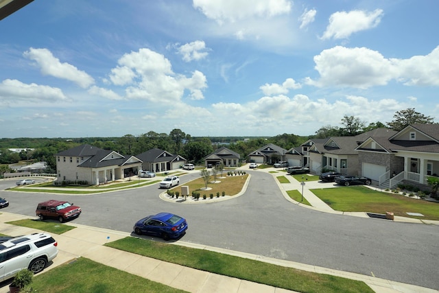 view of road with curbs, sidewalks, and a residential view