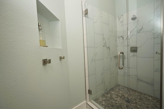 bathroom with a shower stall