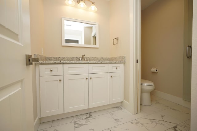 bathroom with baseboards, marble finish floor, toilet, and vanity