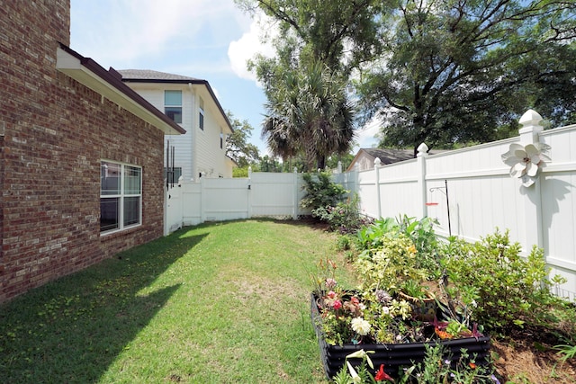 view of yard with a fenced backyard