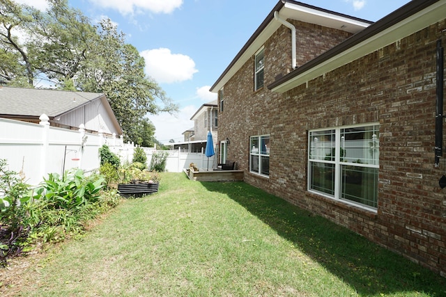 view of yard featuring a fenced backyard and a vegetable garden