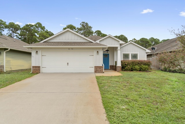 2690 Hartman Ct, Navarre, FL 32566 - ranch-style home with an attached garage, brick siding, driveway, a front yard, and board and batten siding
