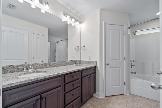 2690 Hartman Ct, Navarre, FL 32566 - full bathroom with visible vents, a sink, tile patterned flooring, double vanity, and washtub / shower combination