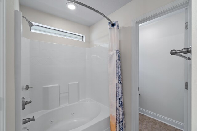 2690 Hartman Ct, Navarre, FL 32566 - bathroom with baseboards and a combined bath / shower with jetted tub