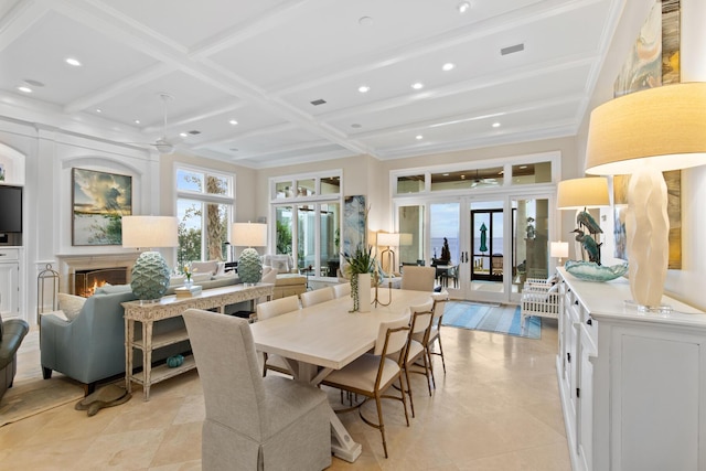 3002 Bay Villas Dr, Miramar Beach, FL 32550 - dining area featuring beamed ceiling, a lit fireplace, recessed lighting, and coffered ceiling