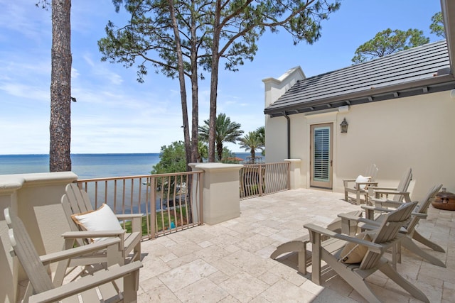 3002 Bay Villas Dr, Miramar Beach, FL 32550 - view of patio featuring a water view and a balcony