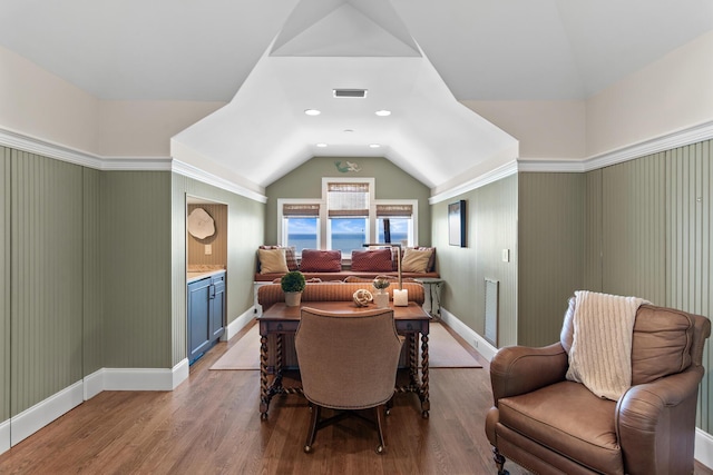 3002 Bay Villas Dr, Miramar Beach, FL 32550 - sitting room featuring vaulted ceiling, wood finished floors, and baseboards